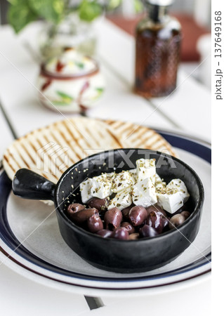 marinated olives and feta cheese tapas snack at outdoor restaurant in mykonos greece marinated olives and feta cheese tapas snack at outdoor restaurant in mykonos greece 137649168