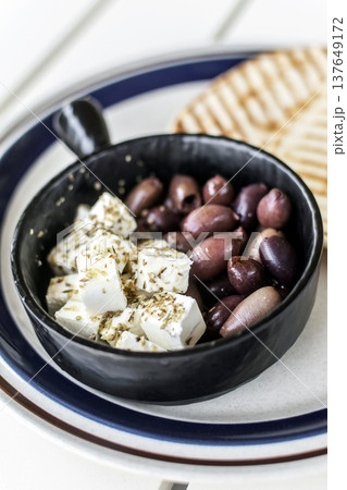 marinated olives and feta cheese tapas snack at outdoor restaurant in mykonos greece marinated olives and feta cheese tapas snack at outdoor restaurant in mykonos greece 137649172