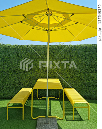 It is an outdoor cafe with parasols. 137649370