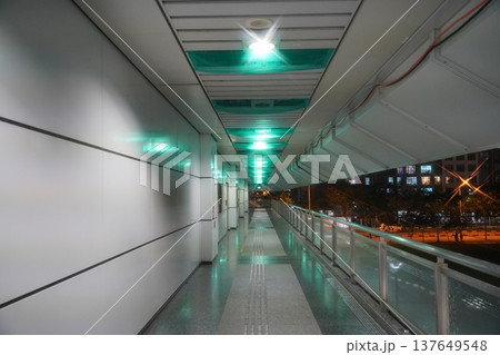 Elevated Walkway with Green Lighting Urban Landscape Elevated Walkway with Green Lighting Urban Landscape 137649548