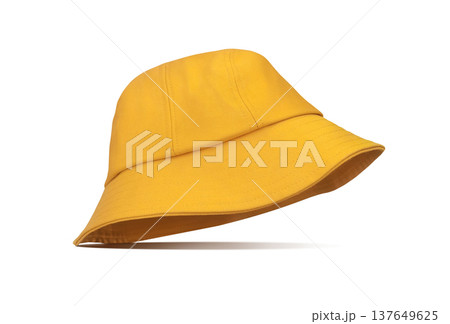 A yellow bucket hat placed stylishly against a white background. A yellow bucket hat placed stylishly against a white background. 137649625