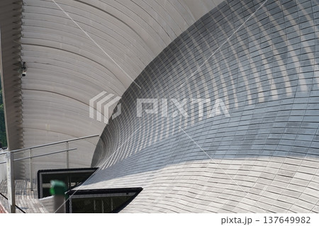 Modern Architectural Design with Curved Wooden Panels Modern Architectural Design with Curved Wooden Panels 137649982