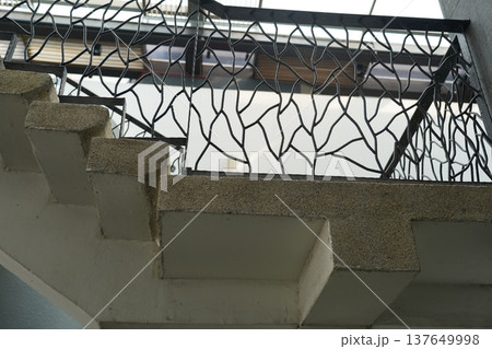 Staircase with Ornate Metal Railing Architecture Detail Staircase with Ornate Metal Railing Architecture Detail 137649998