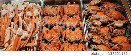 Trays of fresh crabs arranged for seafood barbecue at a restaurant in Sapporo, Japan, showcasing delicious seafood cuisine and buffet-style dining 137651181