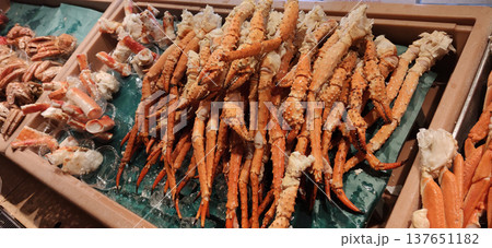 Trays of fresh crabs arranged for seafood barbecue at a restaurant in Sapporo, Japan, showcasing delicious seafood cuisine and buffet-style dining 137651182