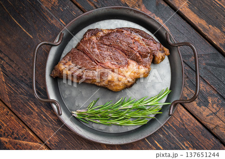 Pan fried beef chuckeye steak with herbs and butter served in skillet. Gourmet cooked beef with copy space. Pan fried beef chuckeye steak with herbs and butter served in skillet. Gourmet cooked beef with copy space. 137651244