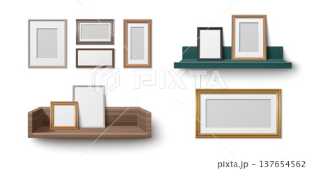 Wooden shelf with photo frames against wall 137654562