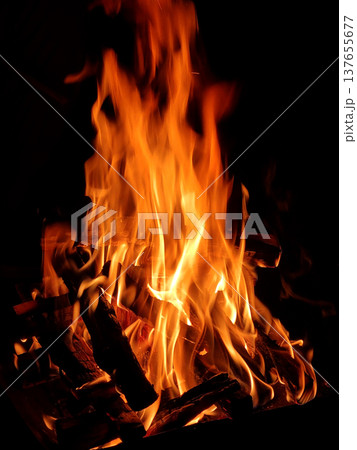 It is a flame rising from a bonfire. It is a flame rising from a bonfire. 137655677