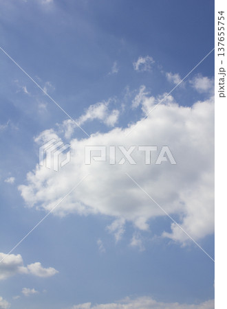 Blue sky with puffy clouds Blue sky with puffy clouds 137655754