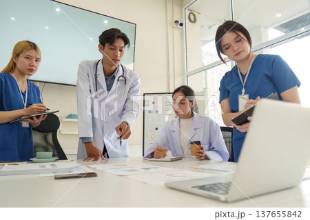 Diverse Healthcare Professionals Collaborating in Meeting Diverse Healthcare Professionals Collaborating in Meeting 137655842
