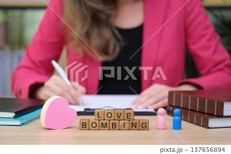 Exploring the concept of love bombing in a modern workspace during a creative brainstorming session Exploring the concept of love bombing in a modern workspace during a creative brainstorming session 137656894