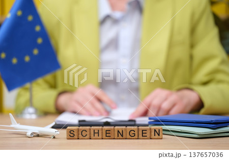 Exploring travel aspirations with Schengen in a vibrant office setting under bright European colors Exploring travel aspirations with Schengen in a vibrant office setting under bright European colors 137657036