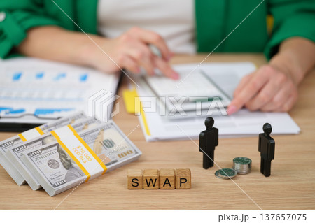Trading cash for coins in a modern financial exchange during a busy workday at the office Trading cash for coins in a modern financial exchange during a busy workday at the office 137657075