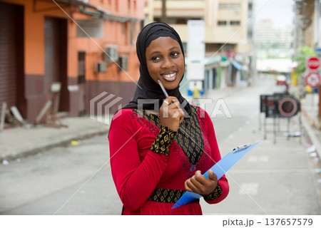 young muslim female student, smiling. 137657579