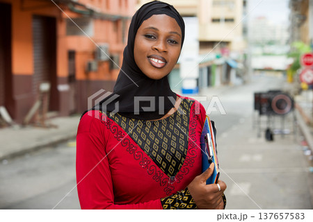 young muslim female student, smiling. 137657583