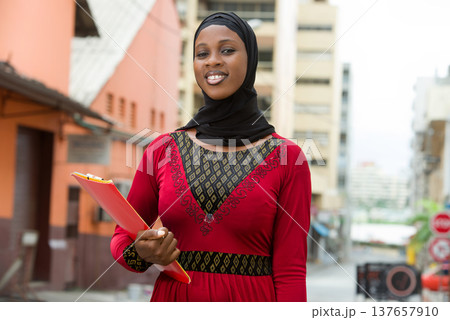 close up of muslim female, smiling. close up of muslim female, smiling. 137657910