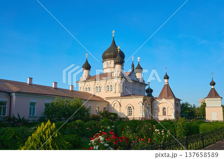 Ortodox women light monastery.Church in the sun rays Ortodox women light monastery.Church in the sun rays 137658589