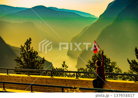 Tourist enjoy fjord view on Stegastein viewpoint Norway Tourist enjoy fjord view on Stegastein viewpoint Norway 137658817