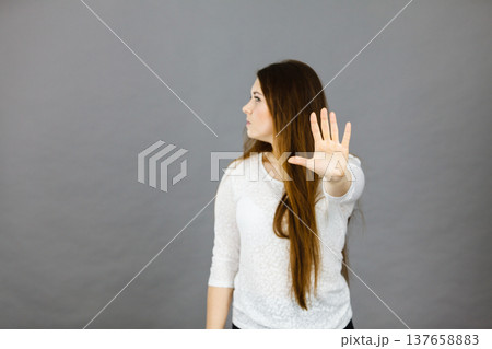 Angry apodicticity woman showing stop with hand 137658883