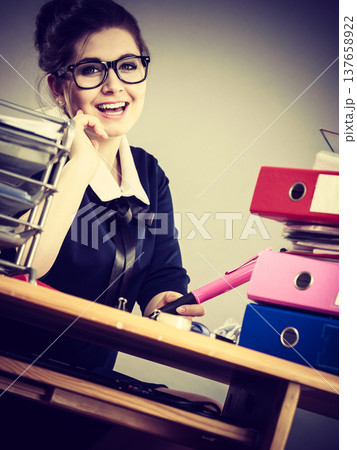 Happy business woman in office Happy business woman in office 137658922