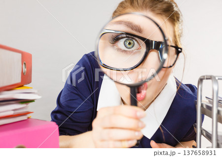 Funny woman office working secretary with magnifier 137658931