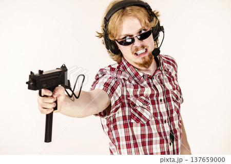 Gamer man shooting from gun 137659000