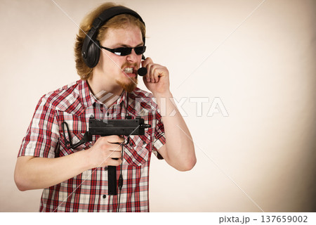 Gamer man shooting from gun 137659002