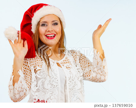 Excited woman in christmas santa hat 137659010