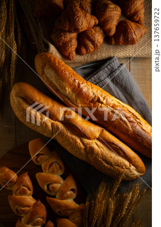 Freshly Baked Assorted Breads on Rustic Wood 137659722
