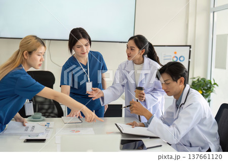 Medical Team Engaged in Collaborative Strategy Session Medical Team Engaged in Collaborative Strategy Session 137661120