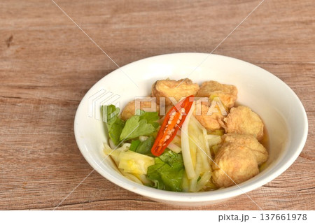 fried white garlic chive with slice yellow egg tofu and chili on bowl fried white garlic chive with slice yellow egg tofu and chili on bowl 137661978