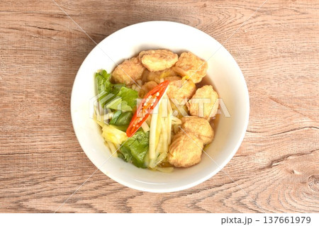fried white garlic chive with slice yellow egg tofu and chili on bowl 137661979