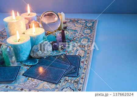 Divining future with lit candles and tarot cards 137662024