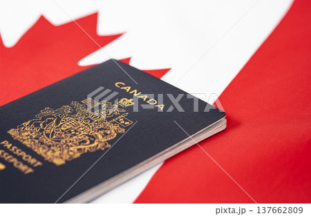 Passport of Canada on the background of a Canadian flag Passport of Canada on the background of a Canadian flag 137662809
