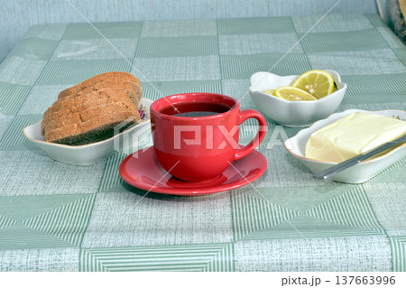 A cup of tea is on the table. 137663996