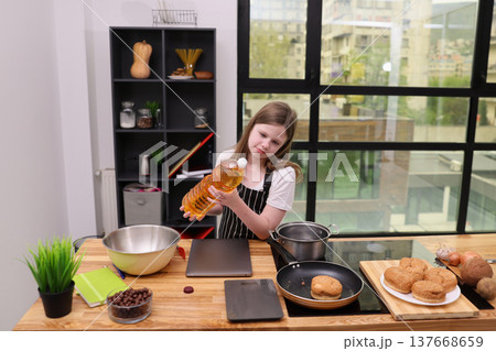 Young chef prepares a delicious meal in a bright, modern kitchen while exploring culinary skills Young chef prepares a delicious meal in a bright, modern kitchen while exploring culinary skills 137668659