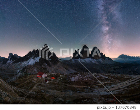 Scenic view of Milky Way over Tre Cime di Lavaredo mountain and Rifugio Locatelli at night in Dolomites, Italy 137670849
