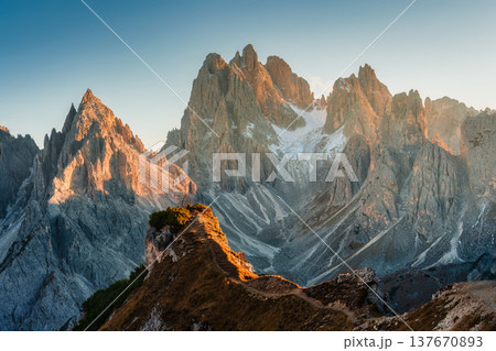 Alpine landscape of Cadini di Misurina with rugged mountain range during sunset in Dolomites, Italy 137670893
