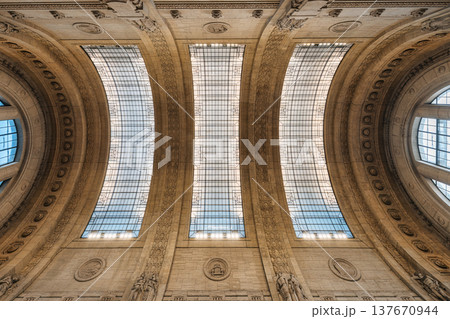 Achitectural interior of grand milano centrale with curved skylight arches and sculpted stone building in Milan station Achitectural interior of grand milano centrale with curved skylight arches and sculpted stone building in Milan station 137670944