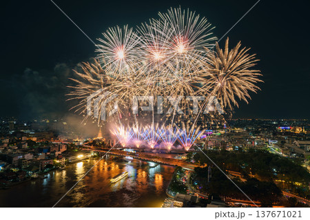 Spectacular fireworks display above Chao Phraya River, Memorial Bridge and Bangkok city at night 137671021