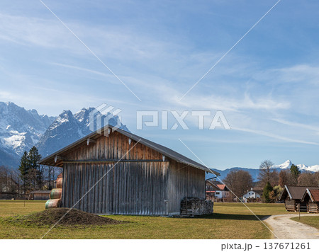 Rural barn and path with Alpine mountains in Bavaria Germany Rural barn and path with Alpine mountains in Bavaria Germany 137671261