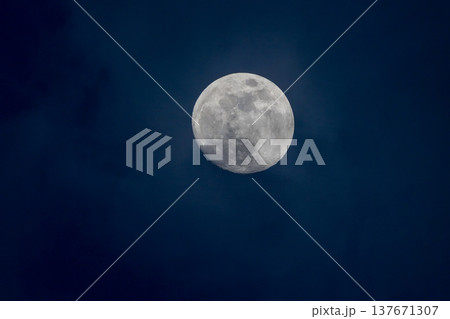 Full moon on a black sky background. Beautiful full moon in a dark night. Abstract wallpaper or background 137671307