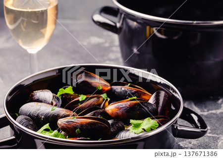 Delicious seafood mussels with sauce and parsley. Delicious seafood mussels with sauce and parsley. 137671386