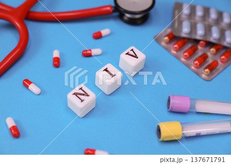 Colorful representation of health care tools and medication related to the NIV technique displayed on a vivid blue background 137671791
