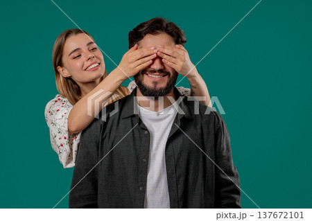 Pretty Woman Closes Eyes Of Her Beloved Boyfriend Before Surprise. Happy Couple Pretty Woman Closes Eyes Of Her Beloved Boyfriend Before Surprise. Happy Couple 137672101