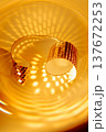 Abstract sparkling golden background with swirl energy for parties sales and awards. Festive poster background for Christmas and New Year promo. 137672253