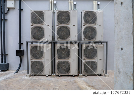 Air conditioner compressor installed in old building. Air conditioner compressor installed in old building. 137672325