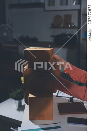 Startup, small business, SME owner check online orders. data logging Business growth, selling products, working with boxes. freelance work at home office online sme business small organization 137672672