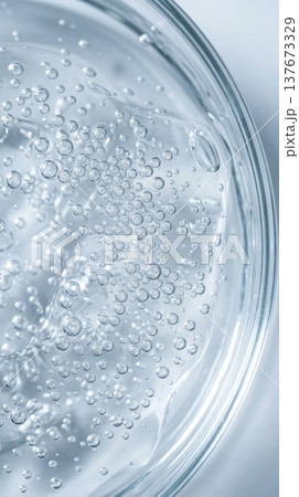 Transparent Hyaluronic Hair Serum Gel with Suspended Bubbles Macro Transparent Hyaluronic Hair Serum Gel with Suspended Bubbles Macro 137673329