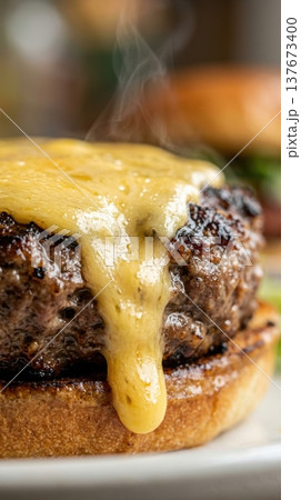 Extreme Macro of Melted Cheddar Cheese Dripping Down Burger Patty Extreme Macro of Melted Cheddar Cheese Dripping Down Burger Patty 137673400